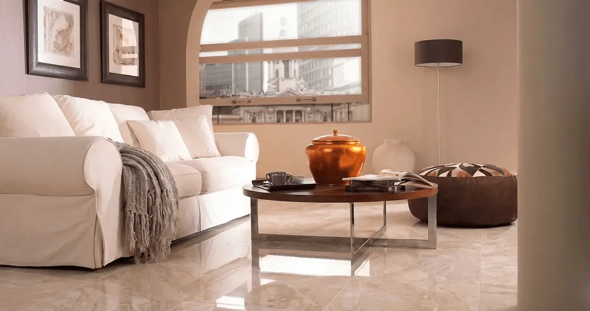 Modern living room with professionally installed marble flooring, a beige sofa, coffee table in New Orleans, LA
