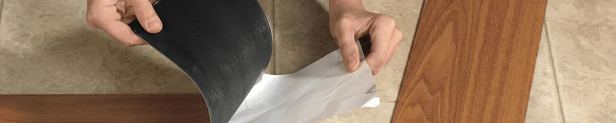 A professional installing vinyl flooring in New Orleans, LA